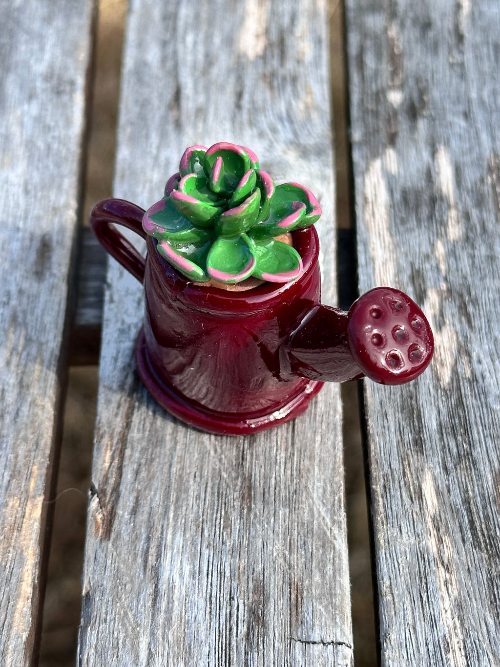 Maroon watering can