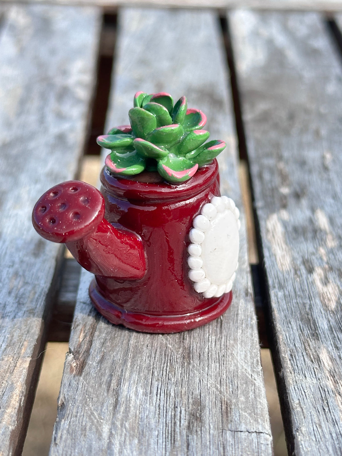 Maroon watering can